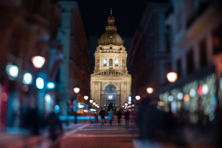 Photo for Budapest, Hungary - January 26, 2024: Blurry crowd against the background of the St. Stephen's Basilica. Focus tilted to Basilica. - Royalty Free Image
