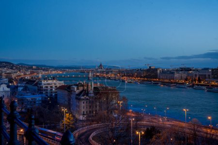Budapest, Hungary - January 27, 2024: Areal view to the city downtown at early morning. Parliament, Danube on the background. Highway on the foreground.