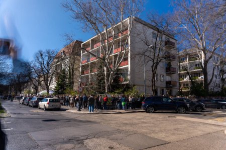 Photo for Budapest, Hungary: March 17, 2024: A big queue at the polling station. Russian President election. - Royalty Free Image