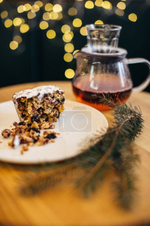 Photo for Traditional English steamed pudding with hot tea for Christmas. - Royalty Free Image