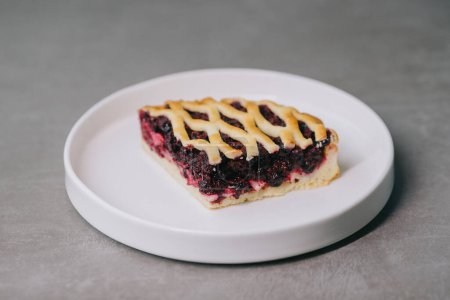 Photo for Delicious blueberry pie on a plate close-up. - Royalty Free Image