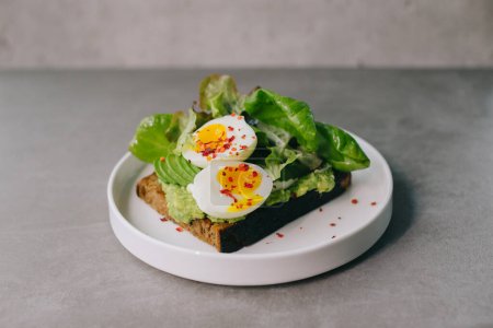 Photo for Delicious toast with avocado and boiled egg. Concept of delicious food. - Royalty Free Image