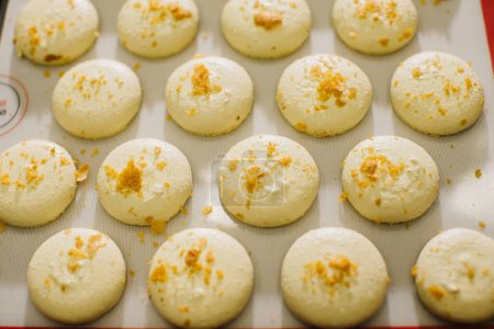 Photo for Freshly baked macaroons on a baking sheet. - Royalty Free Image