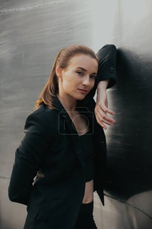 Photo for Fashion street style portrait of pretty girl in black suit. Beautiful brunette posing outdoor. - Royalty Free Image