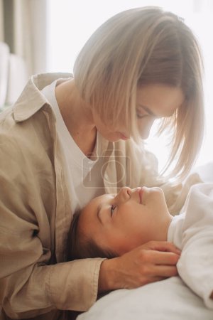 Photo for Mother with her daughter enjoy in bed at the morning - Royalty Free Image