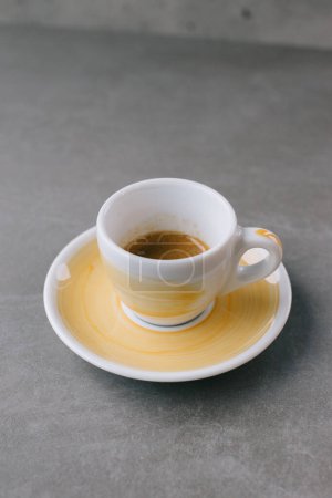 Photo for Close up of a cup of espresso or dopio on a gray stone background. - Royalty Free Image