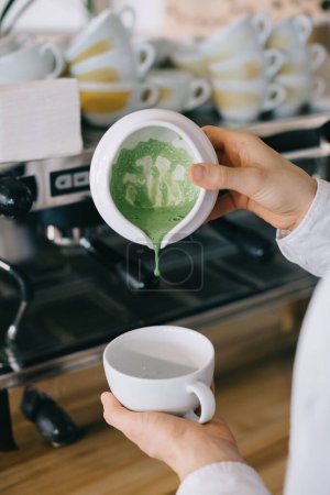 Photo for Close-up, barista prepares matcha. The work process of a barista in a cafe. - Royalty Free Image