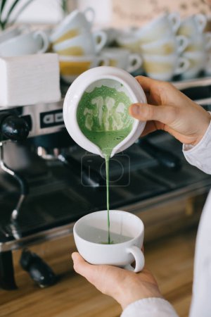 Photo for Close-up, barista prepares matcha. The work process of a barista in a cafe. - Royalty Free Image