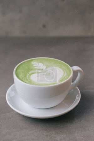 Photo for A cup of matcha on a gray stone background. Close up. - Royalty Free Image