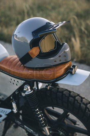 A motorcycle helmet on a motorcycle seat. The concept of traveling and riding a motorcycle.