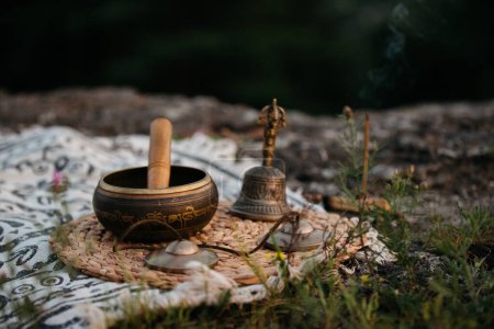 Tibetan copper singing bowl, meditation and alternative medicine items, outdoor.