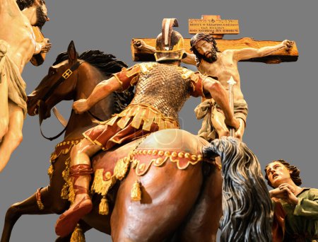Photo for Polychrome wood carvings of the Calvary of Christ with the spear that will be stuck in his chest. These wooden carvings go out in procession during Holy Week in Zamora, Spain. - Royalty Free Image