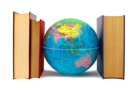 Earth globe escorted by books where you can see Asia and Australia: protection and defense concept. Books, a source of knowledge, flank the Earth as defense, protection and care.