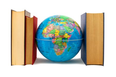 Globe escorted by books where you can see Africa and Europe: protection and defense concept. Books, a source of knowledge, flank the Earth as defense, protection and care.