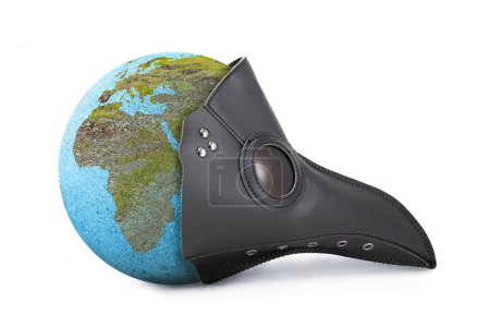 Foto de Earth Globe with the plague mask showing Europe and Africa: epidemic concept (en inglés). La máscara de la peste simboliza la enfermedad y la epidemia que devastó la Tierra. - Imagen libre de derechos