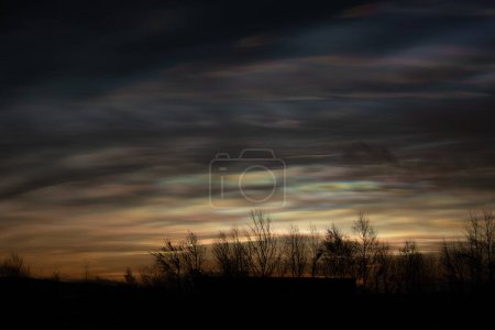 Photo for Diffraction natural phenomenon produce pearl clouds in very cold temperatures. - Royalty Free Image