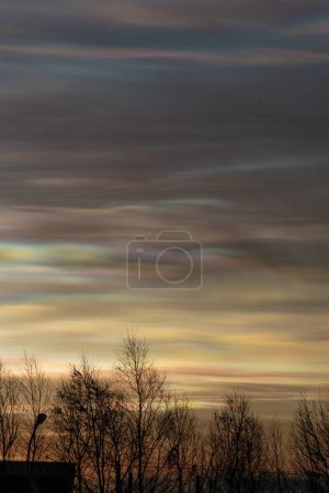 Photo for Diffraction natural phenomenon produce pearl clouds in very cold temperatures. - Royalty Free Image