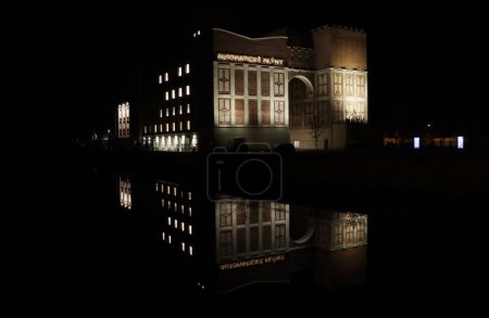 Photo for Night shot of Josef Gocar's Galery at Automaticke Mlyny in Pardubice, reflection in water - Royalty Free Image