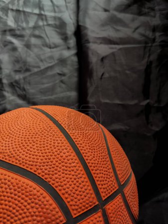 Old basketball with black background