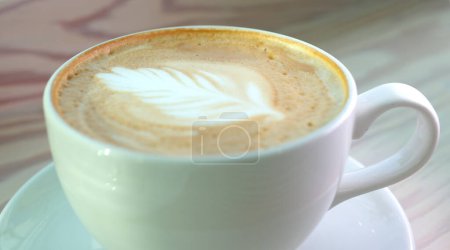 Photo for Cup of cappuccino Turmeric Chai Latte at Cafe - Royalty Free Image