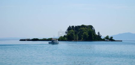 Photo for Monastery on the water, over which planes take off and land Greece Corfu island Vlacherna Monastery - Royalty Free Image