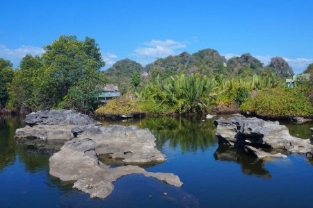 Photo for Maros Rammang-Rammang, panoramic views of clear rivers and shell rocks overlooking trees and mountains - Royalty Free Image