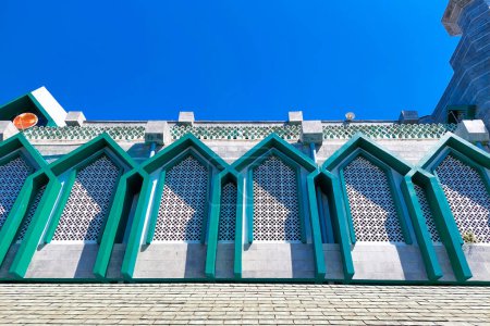 artistic view of the Al-Markaz mosque in Makassar seen outside on a bright day