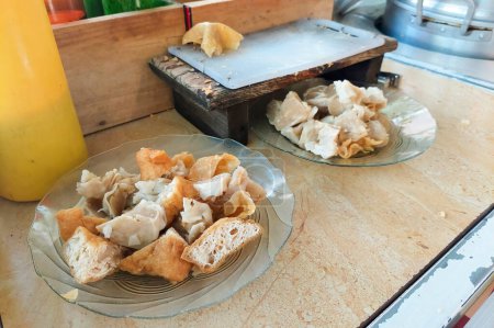 Indonesian food - Batagor is made from fish, tapioca and spices wrapped in dumplings and then fried. Served with spicy peanut sauce