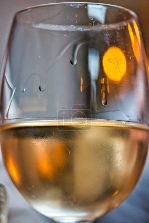 Photo for Close up glass of wine in a restaurant: charming texture - Royalty Free Image