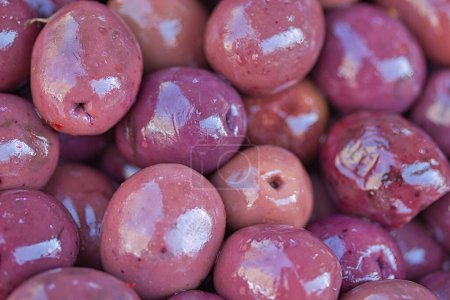 Photo for Tasty kalamata Greek olives at the market: light reflected by the oily skin creating a nice texture - Royalty Free Image