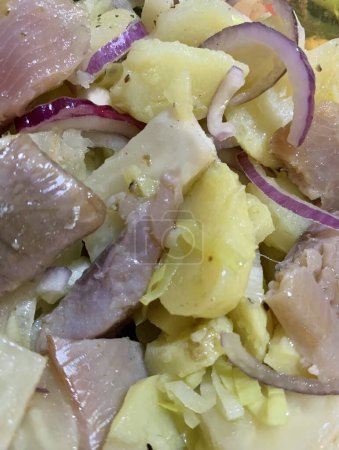 Photo for Close up of herrings with potatoes and onions: yummy food porn macro photography - Royalty Free Image