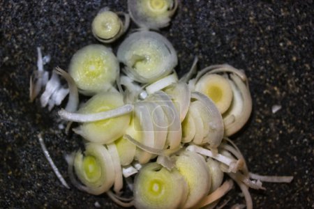 Photo for Fresh sliced leek in kitchen on cutting board - Royalty Free Image
