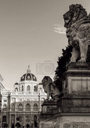 Photo for Majestic guardians of time: In a striking monochrome, a lion statue commands attention in the foreground, a symbol of strength and regality, while a grand cathedral stands tall in the background, an enduring testament to the harmonious blend of natur - Royalty Free Image