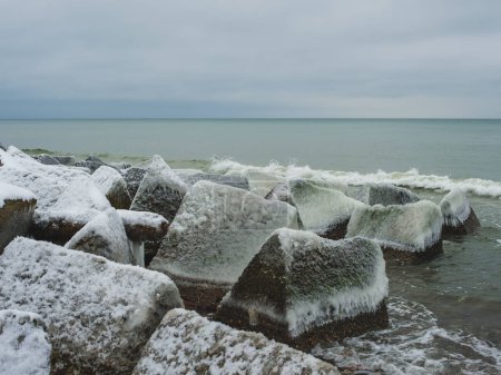 Nature's artwork: snow on the shore.