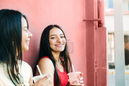 Photo for Portrait of two cheerful young women smiling while talking. friendship and dental health concept. - Royalty Free Image