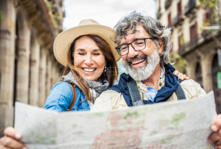 Photo for Happy husband and wife enjoying summer vacation together - Touristic life style concept with aged woman and man traveling European city - Royalty Free Image