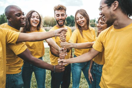 Photo for University students hugging in college campus - Youth community concept with guys and girls standing together supporting each other - Royalty Free Image