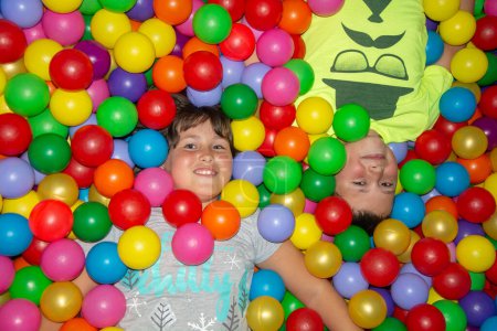 Photo for Boy and girl playing with colorful ball - Royalty Free Image