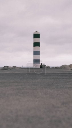 Photo for A large white and green striped tower in the middle of a parking lot - Royalty Free Image
