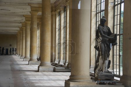 Photo for A serene colonnade adorned with classical sculptures captures the tranquil and historical ambiance of Potsdam, inviting reflection and admiration. - Royalty Free Image