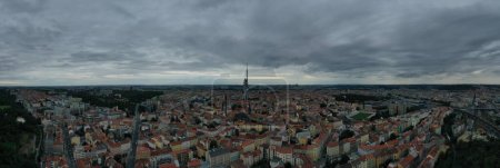 Photo for The drone captures a panoramic aerial sweep of Prague's cityscape, offering a broad view of the sprawling city with its mix of modern and historic buildings. The image encapsulates the vastness of the Czech capital and the variety of its architectura - Royalty Free Image