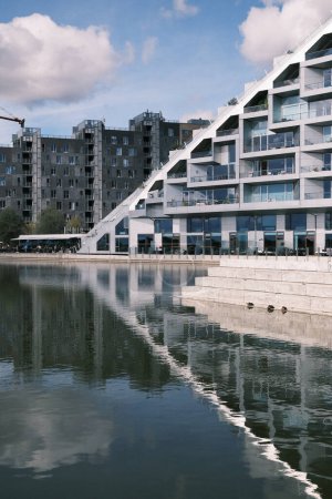 Photo for The serene waters of Denmark serve as a mirror to the modern waterside apartments, reflecting a lifestyle of luxury and calm, seamlessly blending into the tranquil Scandinavian environment. - Royalty Free Image