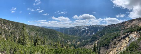 Photo for This panoramic image spans the mountainous forest landscape of Spindleruv Mlyn in Czechia, capturing the rugged terrain and the untouched beauty of the natural world from a breathtaking vantage point. - Royalty Free Image