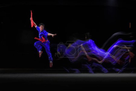 Photo for Chinese Kung Fu Art in Jakarta Indonesia. Shot under several lights to get the effect of movements. Date taken 27 May 2012 - Royalty Free Image