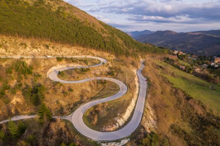 Aerial view of curvy road on slope of monte Nerone in Italy