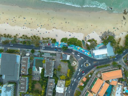 Photo for Aerial top view over Patong beach dolphin circle..The dolphin roundabout is at the end of Patong Beach, next to Kalim Beach..beach crowded with tourists. - Royalty Free Image