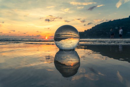 Photo for Magnificent sky above the crystal ball on the beach - Royalty Free Image