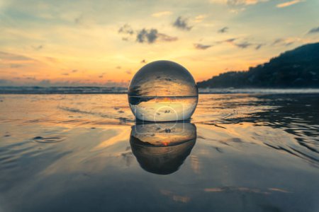 Photo for Magnificent sky above the crystal ball on the beach - Royalty Free Image