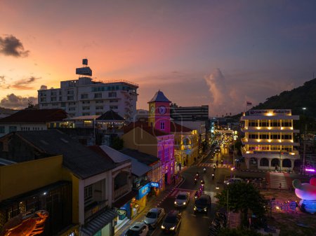 Photo for Editorial Phuket,Thailand-May,20,2023:time lapse lighting show ancient building at Phuket city..Amazing colorful sunset above the buildings in Phuket old town with Sino-Portuguese architecture style. - Royalty Free Image