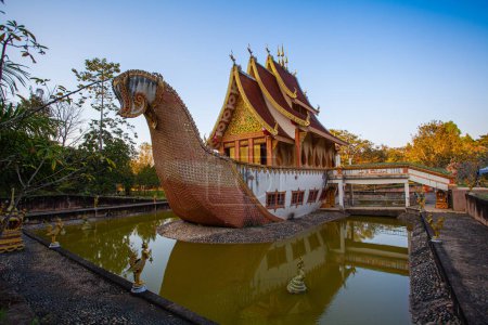 Photo for Scenery The beautiful Suphannahong boat was builted in the pool at Sancomfu temple Chiang Rai Thailand.decorate with gold. This unique style of architecture is often found in traditional Thai art and - Royalty Free Image